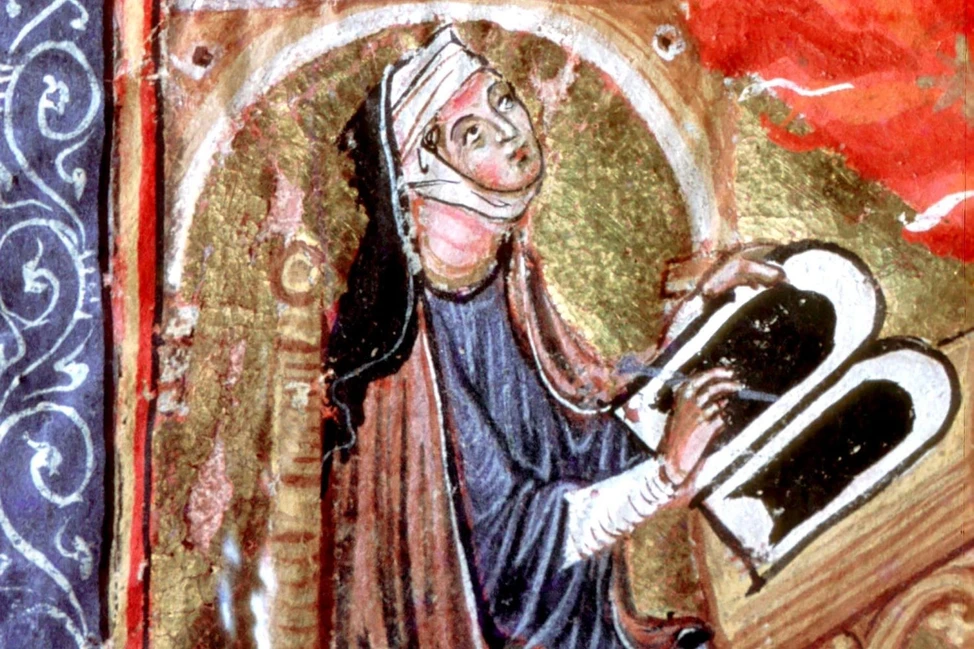 Хильдегарда Бингенская в монашеском одеянии пишет за кафедрой, миниатюра из средневековой рукописи