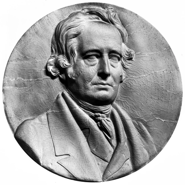 Медальонный портрет Томаса Хэнкока в формальной одежде XIX века, рельеф в круглой рамке